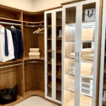 Another side of the closet with the corner shelves and rods. Every space is optimized.