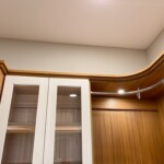 Closer look of the rounded corner shelf and lighting.