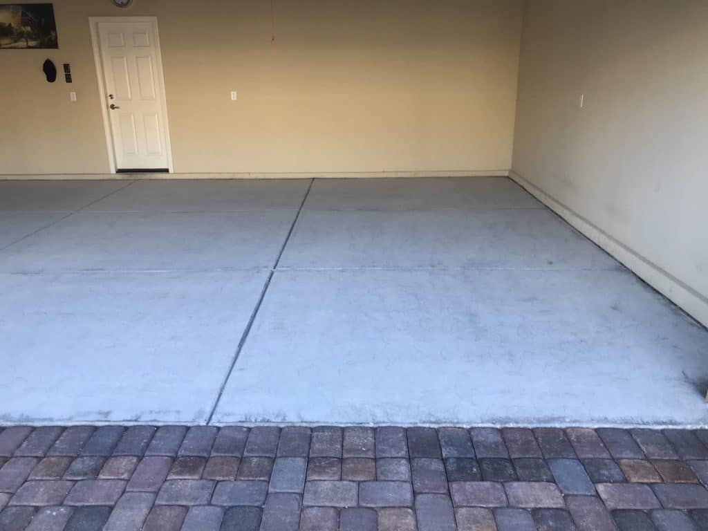 Before photo of a residential garage in Las Vegas without floor epoxy coating