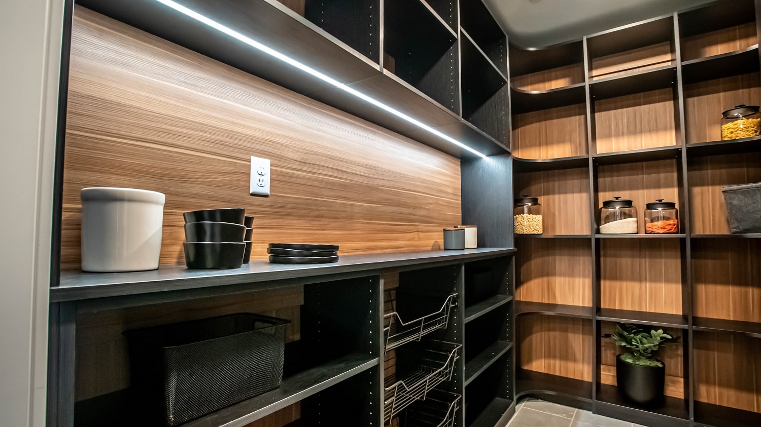 https://closetslasvegas.com/wp-content/uploads/2020/11/dark-brown-shelving-system-and-light-brown-backwall-custom-kitchen-pantry-design.jpg