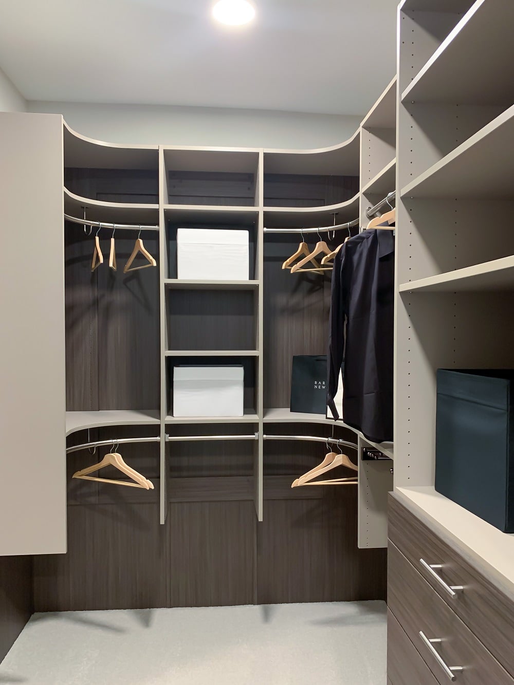 https://closetslasvegas.com/wp-content/uploads/2023/06/04-custom-mens-walk-in-modern-closet-design-double-hang-shelves.jpg