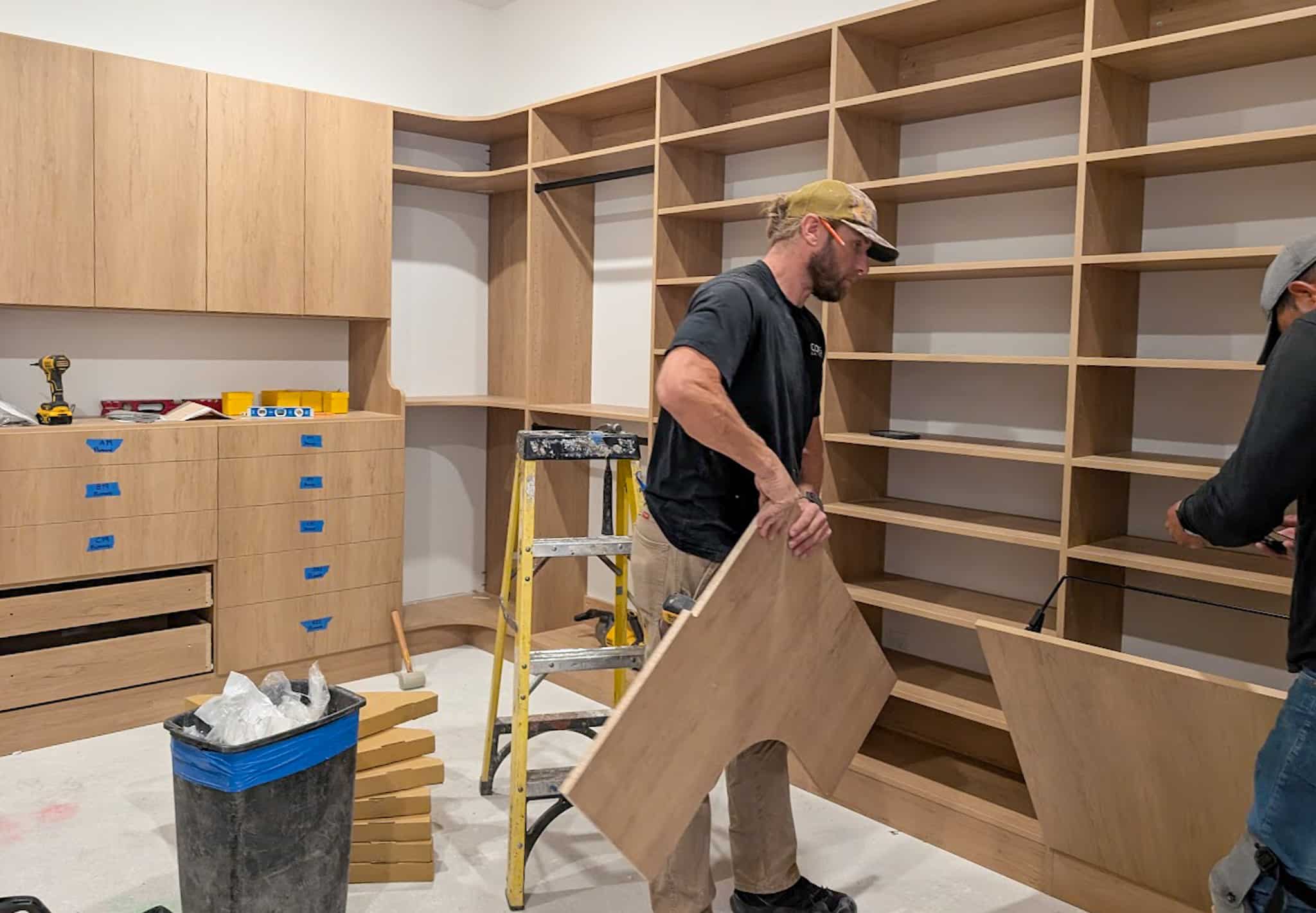 Installers building a custom walk-in closet