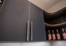 Modern looking cabinet doors with large steel handles in a Las Vegas custom kitchen pantry Las Vegas custom built pantry shelving cabinet doors
