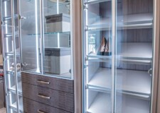 The slightly tinted aluminum framed glass doors and crocodile pattern drawer fronts make this luxury closet design elegant luxury closet design crocodile pattern drawer fronts and shoe racks for her