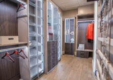 Incredible high end custom closet in Las Vegas with elegant lighted display cabinets and custom drawers Elegant custom drawers and lighted display cabinets Las Vegas high end custom closet