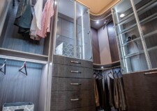 This expensive walk in closet in Las Vegas has elegant custom drawers for closet and aluminum framed shelf glass doors custom drawers for closet and aluminum framed shelf glass doors in an expensive walk in closet