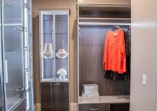 Functional and stylish cabinets, dresser and crocodile texture drawers in this Las Vegas high end custom closet sophisticated features and modern design Las Vegas high end custom closet