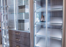 Luxury shoe rack and cabinets with slightly tinted aluminum-framed glass doors and crocodile pattern drawer fronts crocodile pattern drawer fronts and slightly tinted aluminum-framed glass doors