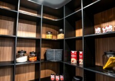 In this custom kitchen pantry design, the light brown-colored walls are massive enough to accommodate a number of shelves. Design Kitchen Pantry Las Vegas, NV