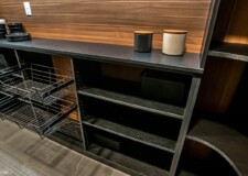 The combination of light brown backwall and dark brown shelves and countertop in this custom kitchen pantry is impeccable. Kitchen Pantry Organizer Systems Las Vegas, NV