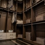 Sophisticated and functional floor to ceiling shelves for Her side closet in a master bedroom with his and hers closets in Las Vegas.