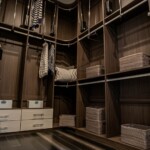 Sophisticated and functional floor to ceiling shelves for Her side closet in a master bedroom with his and hers closets in Las Vegas.