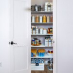 Empty bedroom with open doors leading to the livingroom, bathroom and a closet Adjustable Closet System Las Vegas, NV