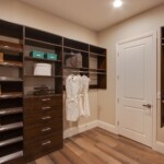 Close up of the her side of the walk in closet design