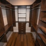 His walk in closet with a traditional design