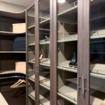 This efficient closet design has a spacious slanted shoe shelves with steel fences. Local Closet Companies Las Vegas, NV