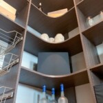 This custom pantry design features open shelves.