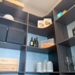View of the top shelves in this efficient pantry design.