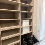 Closer look to the pull out hamper and shoe shelves.