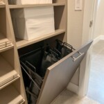 Perfect for professionals on the go, this efficient closet design has a pull out hamper you can use to keep your laundry.