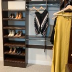 Her side of the walk in closet with shoe shelves, upper shelves, and double hang shelves. Luxury His And Hers Walk In Closet Las Vegas, NV