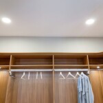 His and Her small walk in closet with true lighting interior and rounded corners.