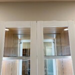 Keep your purses in this glass enclosed cabinet with true lighting!