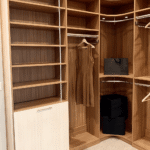 This walk in closet also has a variety of shelves. Hang your dresses in the long hang shelf, your dress shirts in the top shelf, and your pants in the bottom shelf!