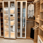 Side view of the glass enclosed cabinet and shoe shelves.