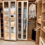 Side view of the glass enclosed cabinet and shoe shelves.