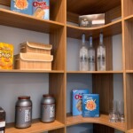 The Closets Las Vegas team used the color Cypress Live so your pantry has a bright and happy design.