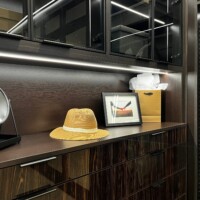 This custom walk in closet also features an interior lit crown molding.