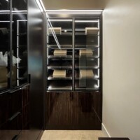 Full view of the shoe shelves with the hidden hampers below it.