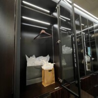 Inside the glass door of this custom walk in closet.