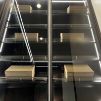 Closer look of the slanted shoe shelves with lighting.