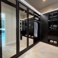 Side view of the primary closet mirrored doors.