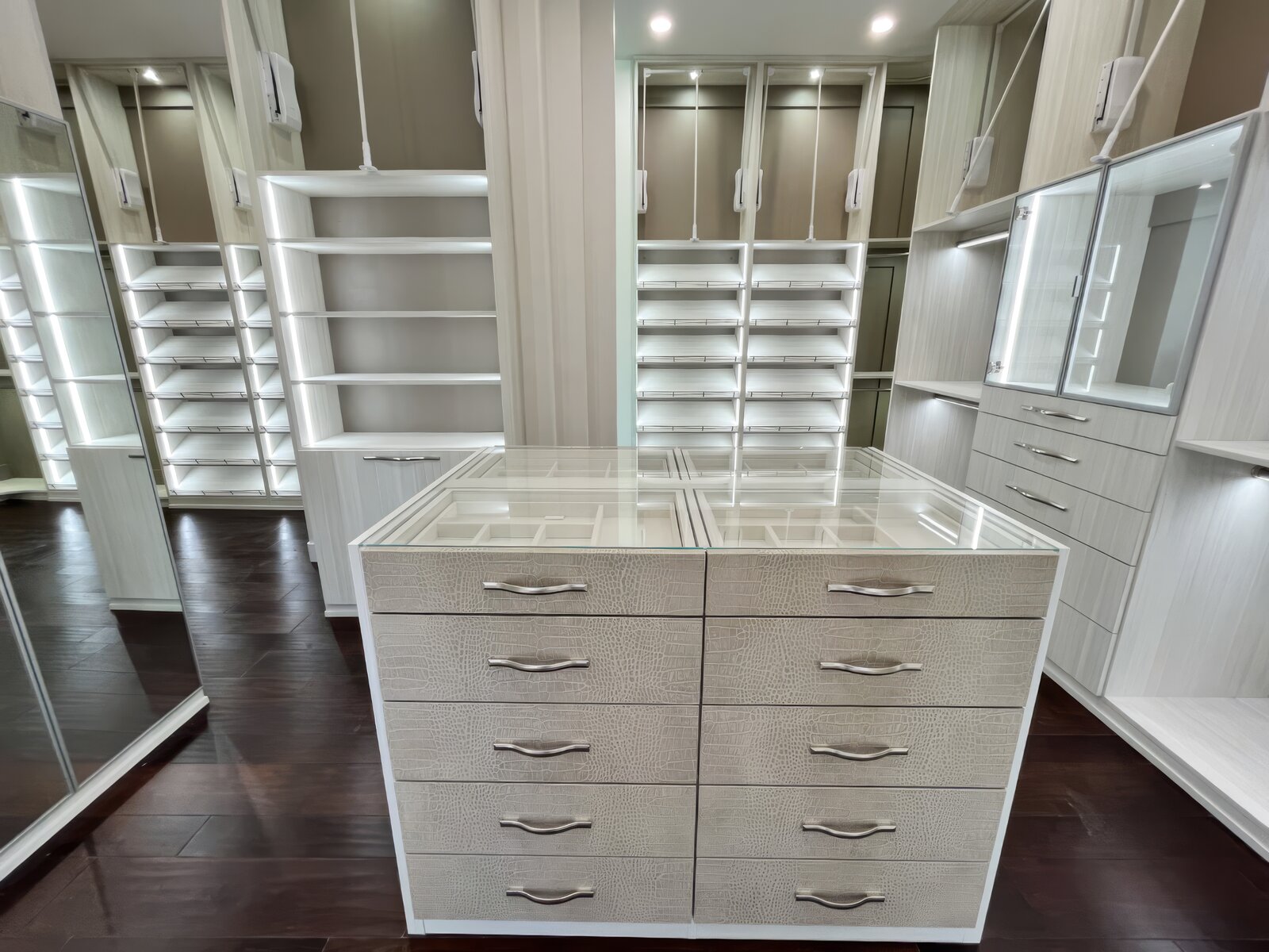 White custom closet with island and glass shoe display